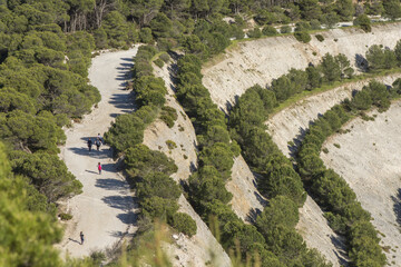 Aerial shot of people walking on a reforestation dolomite quarry in Malaga, Spain
