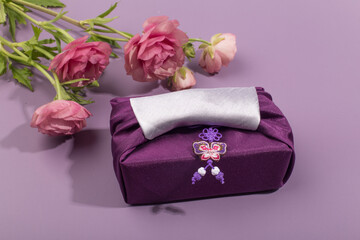 Korean traditional wrapping cloth on the color background. wrapping cloth gift packaging.