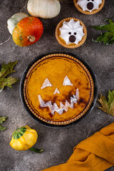 Halloween pumpkin pie in shape of jack-o-lantern