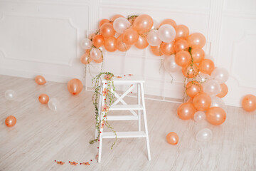 Decorations for holiday party. A lot of balloons. Round photo zone with balls