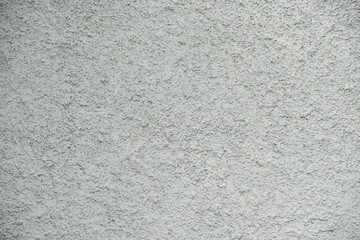 close-up grunge gray concrete wall texture background, cement walls are decorated with plastering techniques to have rough surface like cement dripping for decoration exterior facade building wall