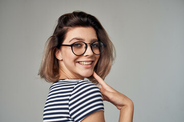 pretty woman in a striped T-shirt modern style hairstyle