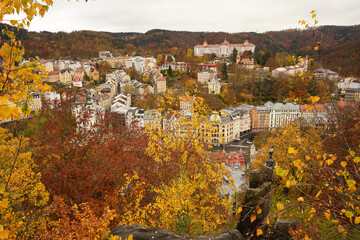 Karlovy Vary famous chamois statue, symbol of spa town in autumn atmosphere with yellow coloured trees, Karlovy Vary, Czech Republic © Milan