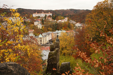 Karlovy Vary famous chamois statue, symbol of spa town in autumn atmosphere with yellow coloured trees, Karlovy Vary, Czech Republic © Milan