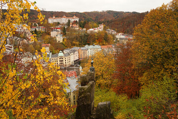 Karlovy Vary famous chamois statue, symbol of spa town in autumn atmosphere with yellow coloured trees, Karlovy Vary, Czech Republic © Milan