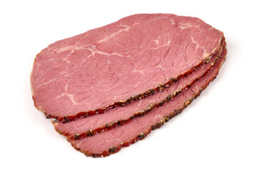 Smoked tenderloin slices, isolated on white background.