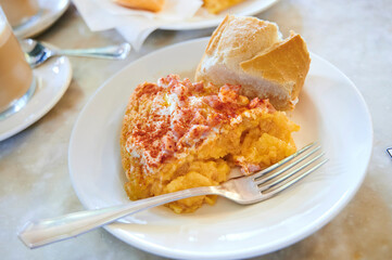 Breakfast with Spanish omelette with mayonnaise and ham