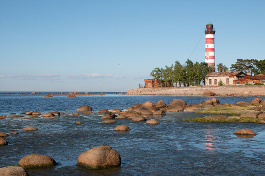 Leningrad region, Russia - 20 August 2020: Shepelevsky lighthouse on the background of the Gulf of Finland on a sunny day.
