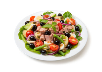 Nicoise salad with tuna, tomatoes, lettuce, olives in a white plate isolated on white background....