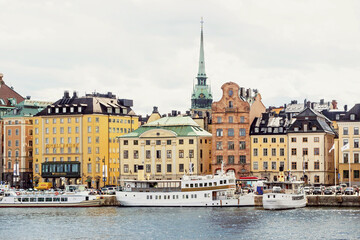Fototapeta na wymiar old buildings at seaside in old town Stockholm