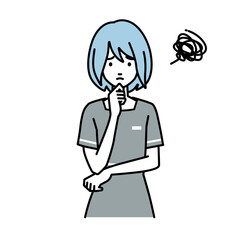 立って手をあごにあてて困っているエステ店員の女性