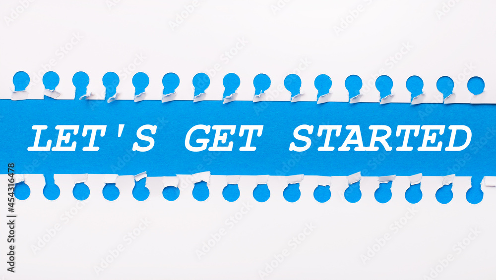 Aufkleber on a blue background with text let is get started two white torn strips of paper.