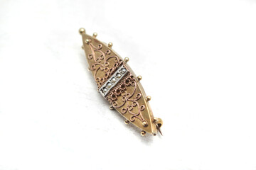 Gilded and silver-plated Victorian brooch with pearls. - obrazy, fototapety, plakaty