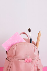 Backpack with school supplies. Back to school concept.