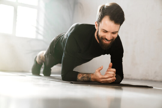 Confident Mid Aged White Sportsman Exercising