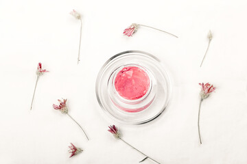 Abstract cosmetic laboratory. home made natural cream gel on a white background organic flax. Natural cosmetics for care, homeopathy. Flat style, top view