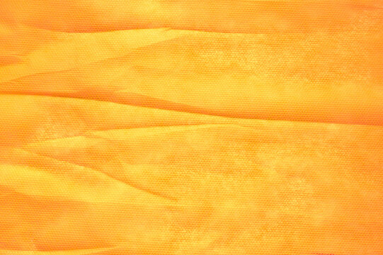 Abstract wrinkles orange paper texture background