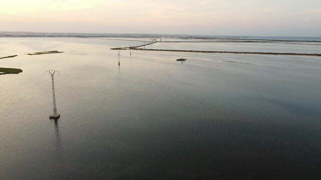 House isolated by water in mediterranean sea drone view. Lonely house in island surrounded by water as a consecuence of sea level growth due to melt down of polar ice, defrostation. 
