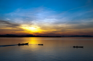 Myanmar. Mon State. Mawlamyine (Moulmein). Fishermen on the Salouen river at sunset