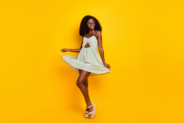 Full body photo of young black girl happy positive smile gorgeous dress sunglass isolated over yellow color background