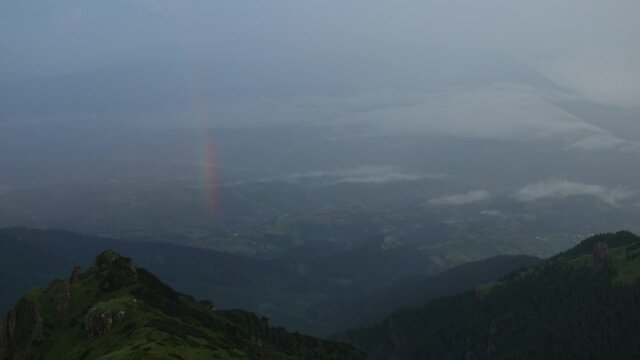 Amazing rainbow in the high mountain after rain