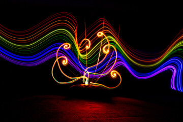 Abstract flower created with light. Light-painting photography. Light rainbow effect.