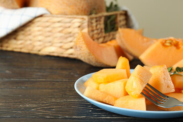 Concept of fresh food with melon pieces on rustic wooden table