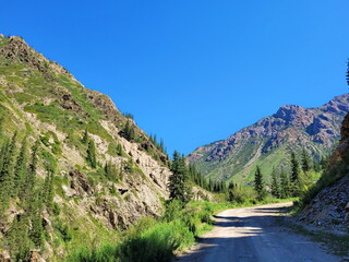 A cliff road among steep mountains