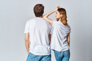 man and woman in white t-shirts design studio back view mocap