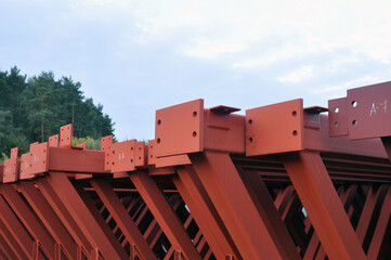 Steel metal structures on the internal territory of an industrial enterprise. Warehousing of trusses