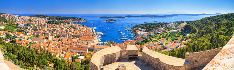 Fototapeta na wymiar Coastal summer landscape, panorama from the fortress - top view of the town of Hvar, on the island of Hvar, the Adriatic coast of Croatia