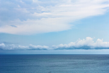 Naklejka na ściany i meble Blue sky and white clouds over sea