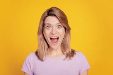 Portrait of amazed nice funky lady open mouth crazy face sale news reaction on yellow background