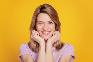 Fototapeta na wymiar Portrait of tender smart attractive lady toothy shiny smile on yellow background