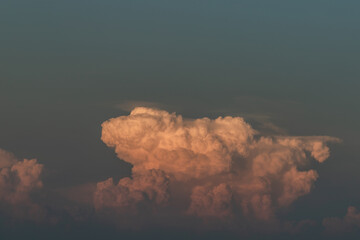 Beautiful orange clouds with dramatic light and blue sky. Beautiful blazing sunset landscape, Warm Colours,  Inspirational concept with copy space.