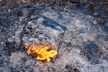 Diary on fire, book burning in bonfire, destruction by fire of books or other written materials, censorship concept. Burning of documents, forbidden knowledge