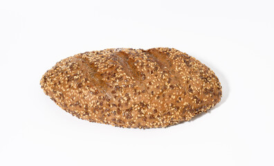 oblong baked bread made from rye flour with white sesame seeds and flax seeds