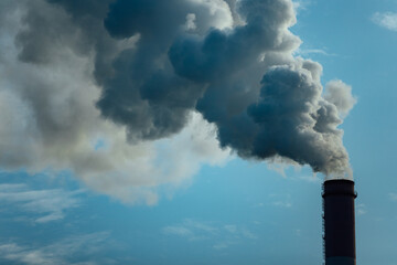 smoking chimneys of factories. pollution of the atmosphere by emissions and carbon dioxide. harmful...