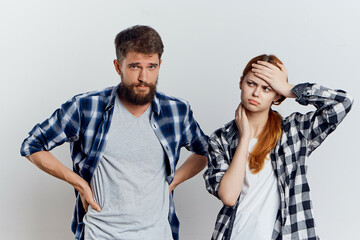 young couple in plaid shirts communication emotions isolated background