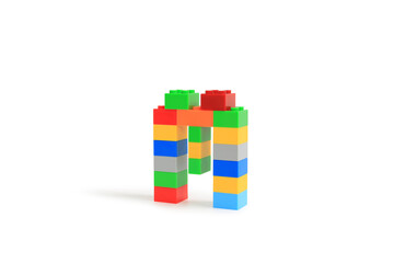 Alphabet letters M from colorful plastic brick block constructor isolated on white background. Image with Clipping path