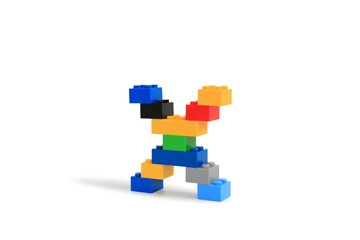 Obraz premium Alphabet letters X from colorful plastic brick block constructor isolated on white background. Image with Clipping path