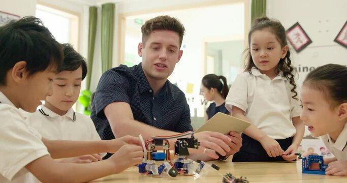 Children learning coding in kindergarten classroom,4K