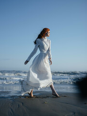 pretty woman in white dress beach ocean lifestyle luxury