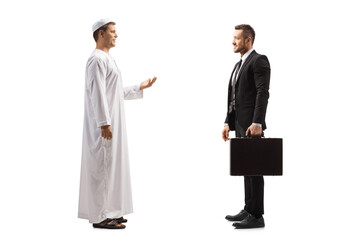 Fototapeta premium Full length profile shot of an arab man having a conversation with a businessman