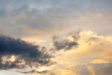 Naklejka na ściany i meble Beautiful clouds at sunset. Close-up. Natural background.