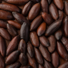 Obraz premium Closeup top view of baru nuts. Food backdrop