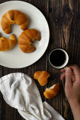 Italian breakfast with coffee, milk and croissant