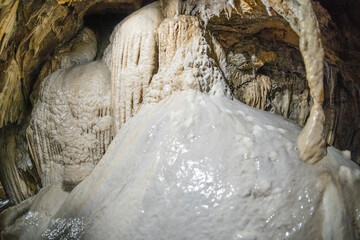 Italy Lucca Garfagnana Trimpello, exploration of natural cave excavated by Underwrane River - obrazy, fototapety, plakaty