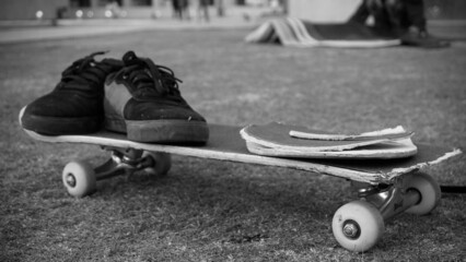 Broken skateboard with shoes after a failed trick at the skatepark, China © Frederik