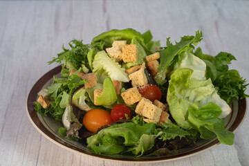 A serving of garden salad. Selective focus points. Blurred background